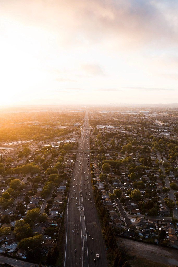 Aerial view of a city highway at sunrise